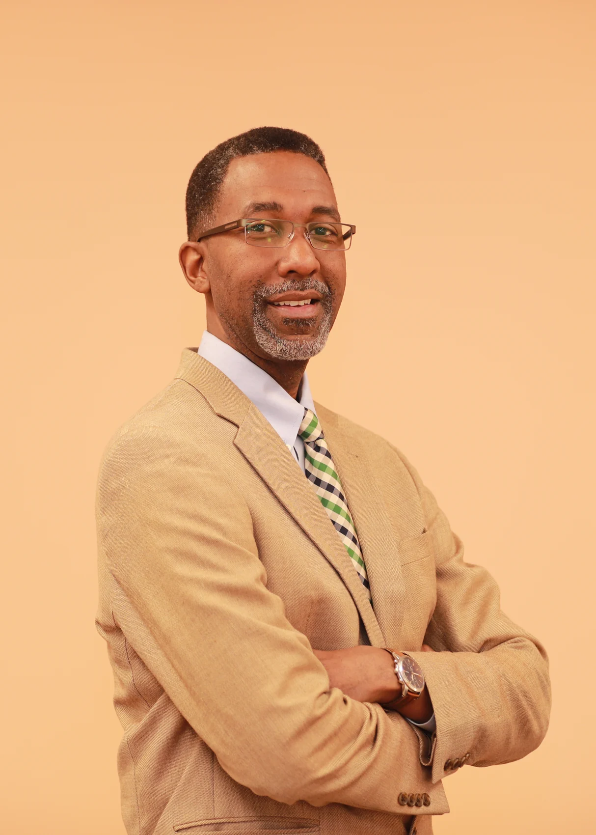 George Walker in a tan suit